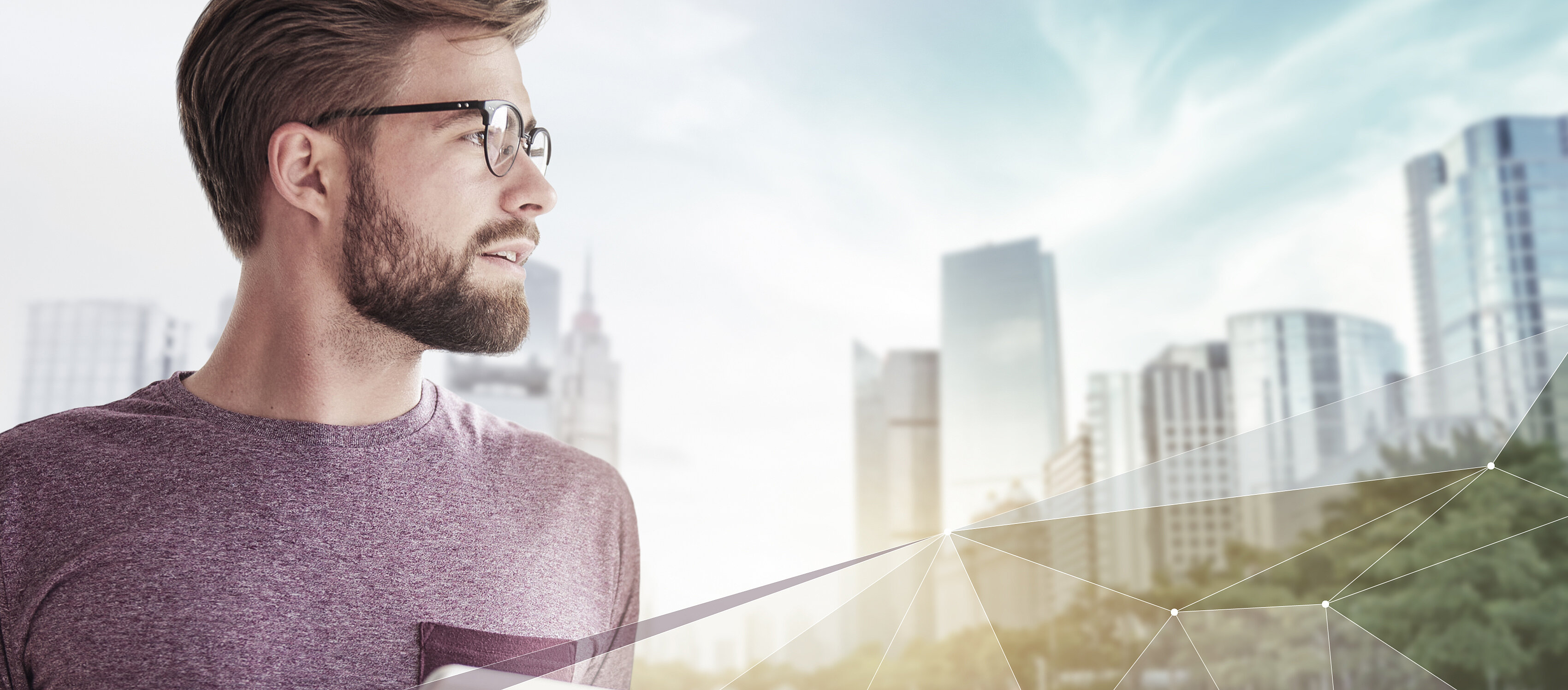 IBU-tec offre une expertise en ingénierie des procédés thermiques et en capacités pour la fabrication en sous-traitance de matériaux chimiques, image avec barbe, tablette et lunettes devant une ville en réseau